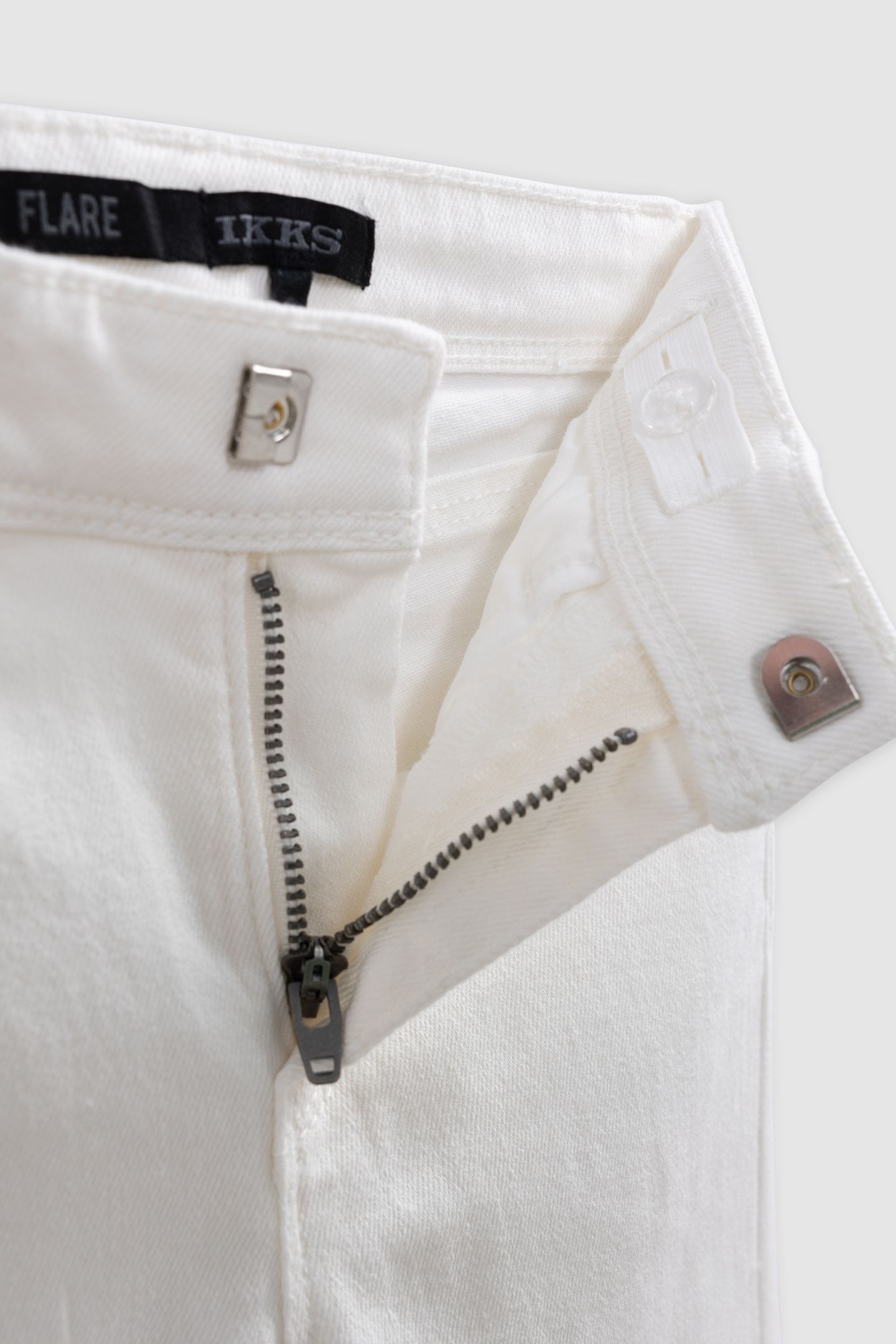 FLARE ECRU JEANS WITH STUD AND EYELET DECORATION 4